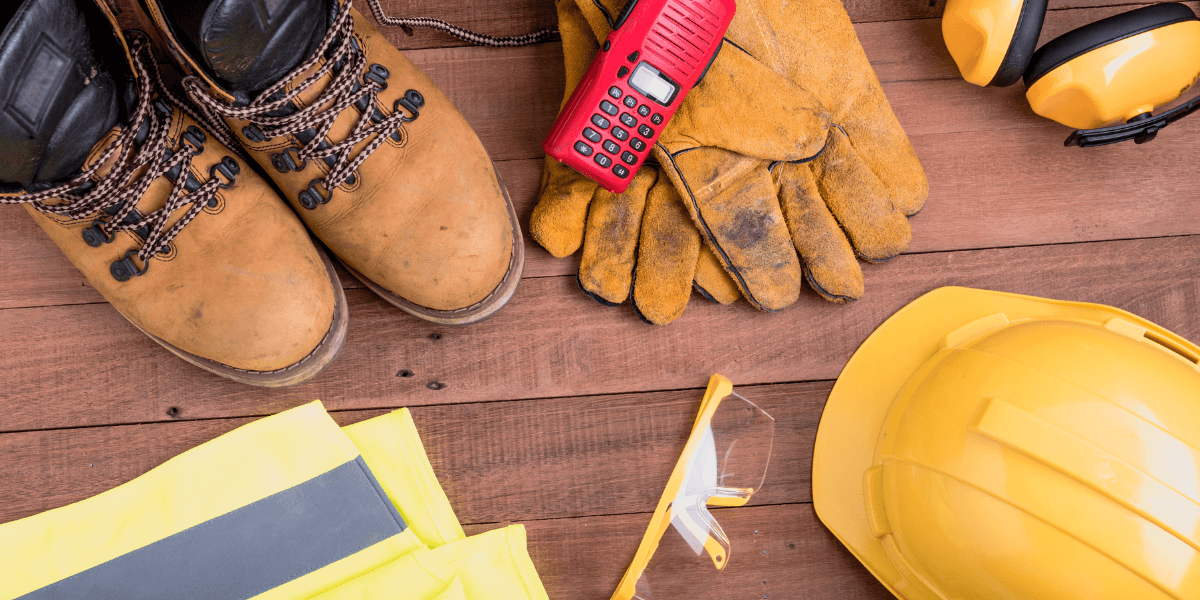 Construction safety gear including boots gloves a hard hat and protective eyewear